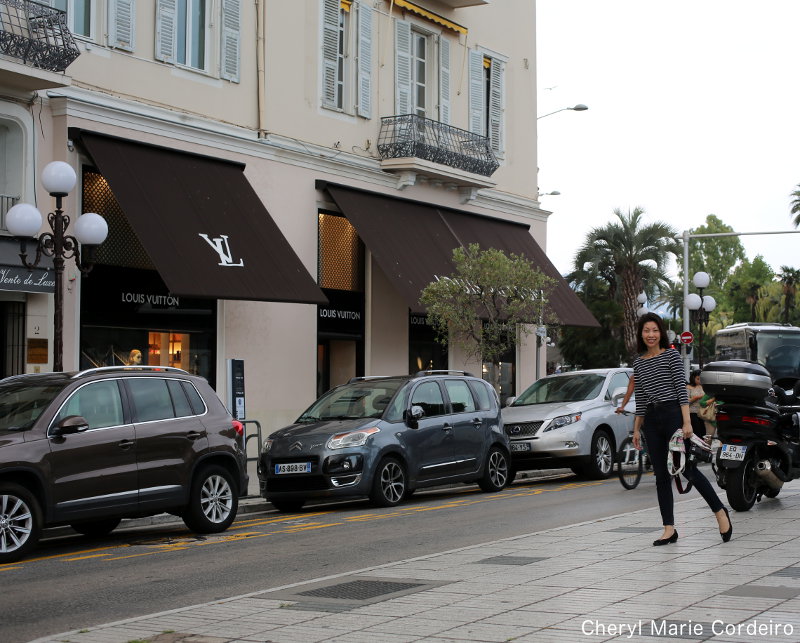 PARIS-APR 14: Customers are on queue to enter Louis Vuitton shop at Champ  Elysee avenue